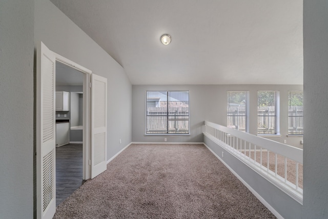 8810 Enchanted Forest Dr, Houston, TX 77088 - carpeted spare room with baseboards, a wealth of natural light, and lofted ceiling