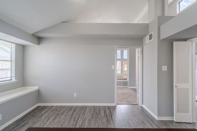 8810 Enchanted Forest Dr, Houston, TX 77088 - unfurnished room with visible vents, baseboards, lofted ceiling, and wood finished floors