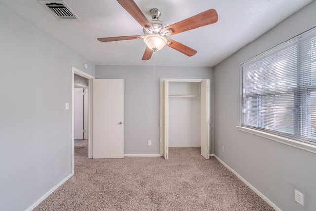 8810 Enchanted Forest Dr, Houston, TX 77088 - unfurnished bedroom with visible vents, a ceiling fan, a closet, baseboards, and carpet flooring