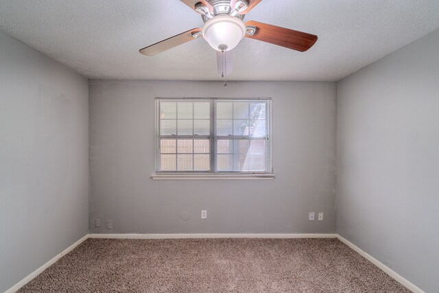 8810 Enchanted Forest Dr, Houston, TX 77088 - spare room featuring carpet floors, a ceiling fan, and baseboards