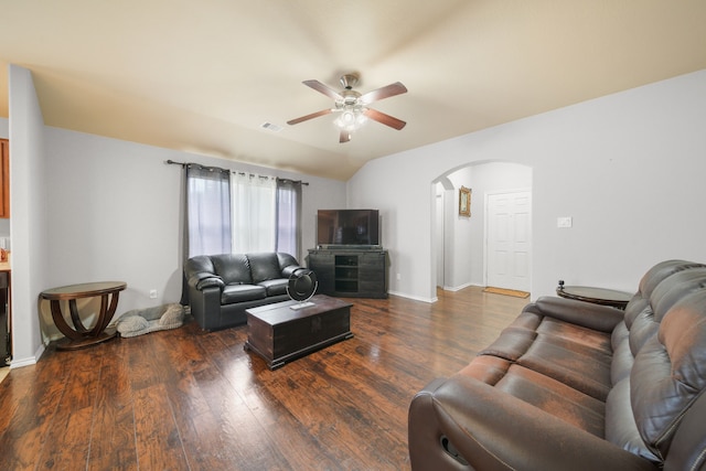 living area featuring arched walkways, a ceiling fan, wood finished floors, and visible vents