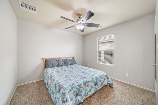 carpeted bedroom with baseboards, visible vents, and ceiling fan