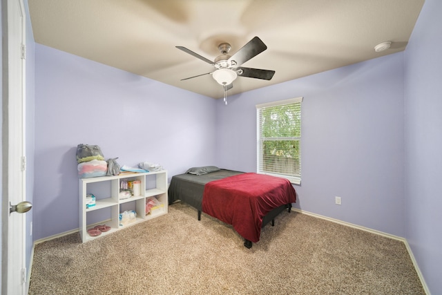 bedroom featuring baseboards, carpet flooring, and ceiling fan