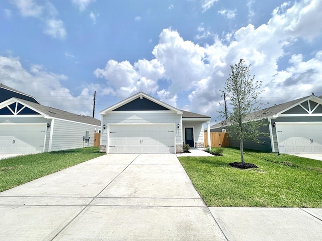 ranch-style home with concrete driveway, stone siding, fence, a front lawn, and a garage
