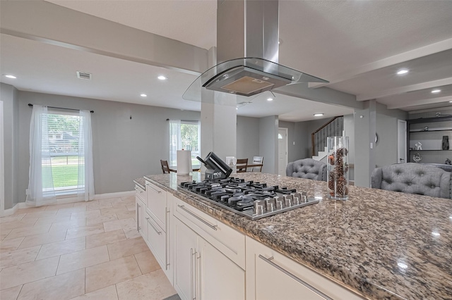 6015 Allentown Dr, Spring, TX 77389 - kitchen with stainless steel gas cooktop, island exhaust hood, open floor plan, dark stone counters, and recessed lighting