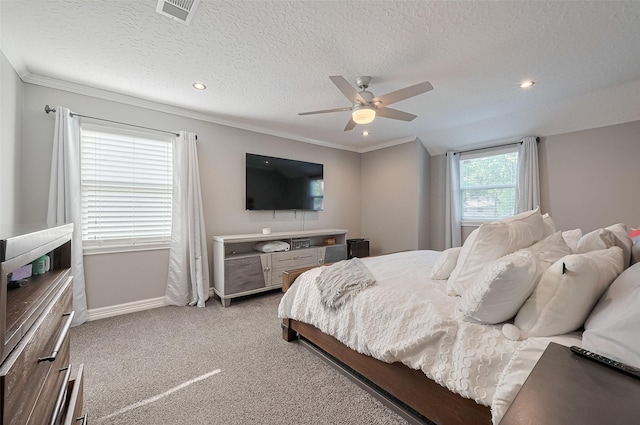 6015 Allentown Dr, Spring, TX 77389 - bedroom with baseboards, ornamental molding, carpet flooring, a textured ceiling, and ceiling fan