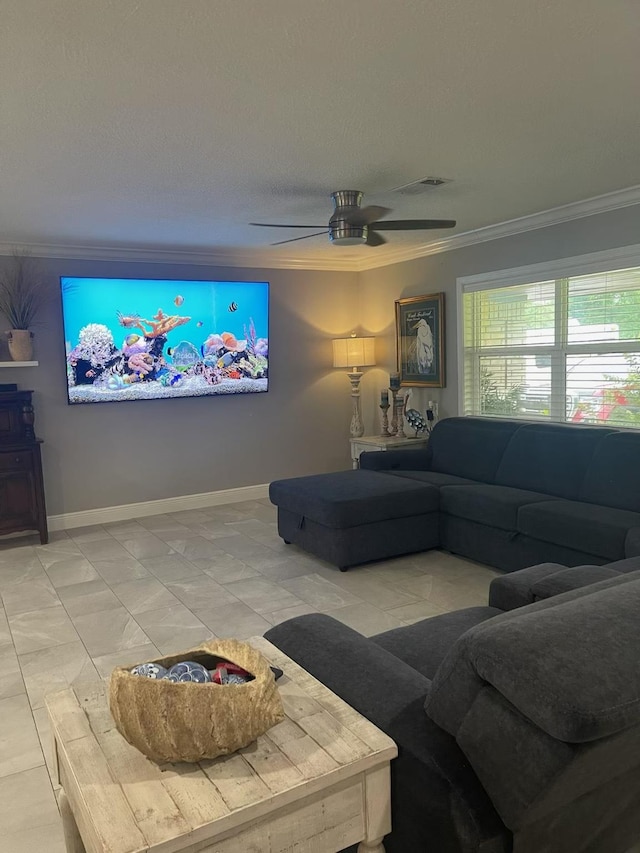 living room featuring crown molding, ceiling fan, and a wood stove