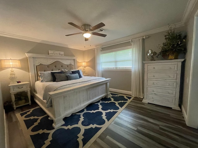 bedroom with ornamental molding, wood finished floors, baseboards, and ceiling fan