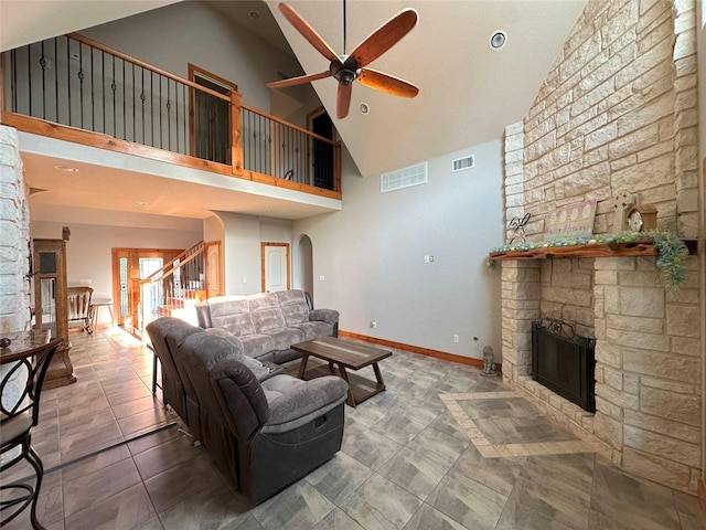 15395 Kitty Hawk Dr, Waller, TX 77484 - tiled living area featuring high vaulted ceiling, a ceiling fan, a stone fireplace, and visible vents