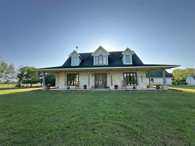 15395 Kitty Hawk Dr, Waller, TX 77484 - back of property with stone siding, a porch, and a yard