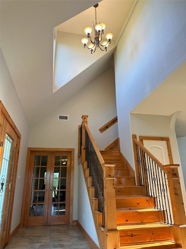 15395 Kitty Hawk Dr, Waller, TX 77484 - stairway featuring high vaulted ceiling, a chandelier, french doors, baseboards, and visible vents