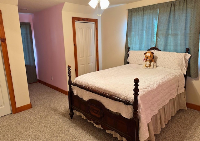 15395 Kitty Hawk Dr, Waller, TX 77484 - bedroom with light carpet, a closet, and baseboards