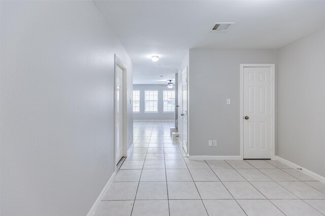 4934 S Cancun Dr, Houston, TX 77045 - corridor featuring baseboards, visible vents, and light tile patterned flooring
