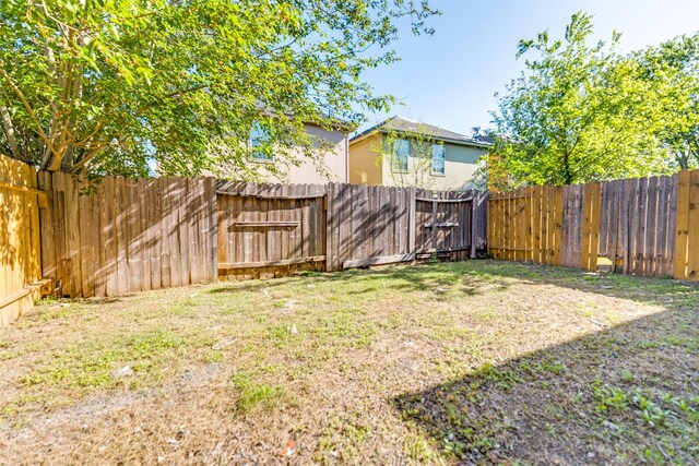 4934 S Cancun Dr, Houston, TX 77045 - view of yard with a fenced backyard