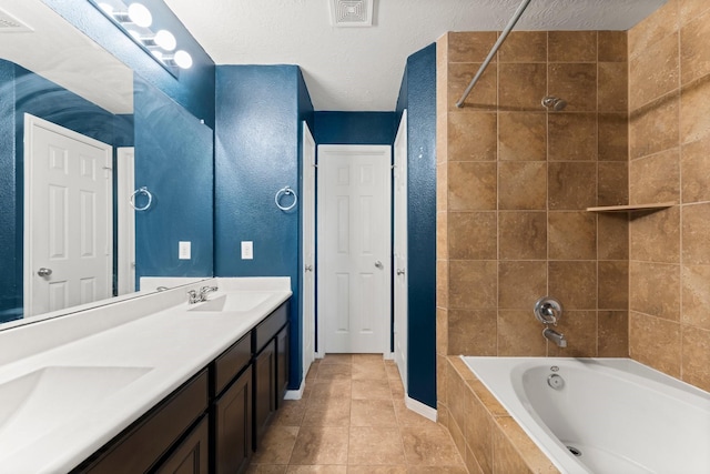 bathroom featuring a sink, double vanity, baseboards, tile patterned flooring, and visible vents
