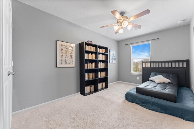 bedroom with baseboards, carpet, and ceiling fan