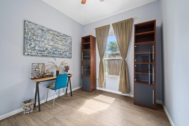 office with baseboards, a ceiling fan, and wood finished floors
