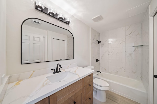 661 Bering Dr Unit 301, Houston, TX 77057 - bathroom featuring vanity, toilet, tub / shower combination, and wood finished floors