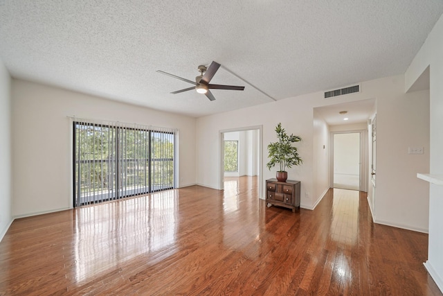661 Bering Dr Unit 301, Houston, TX 77057 - spare room with ceiling fan, a textured ceiling, and wood finished floors
