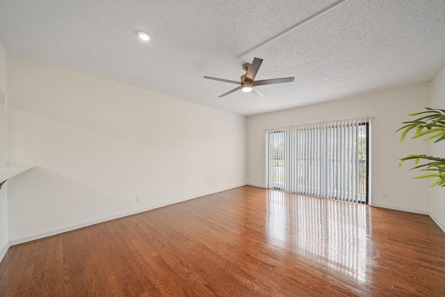 661 Bering Dr Unit 301, Houston, TX 77057 - spare room with ceiling fan, wood finished floors, a textured ceiling, and baseboards