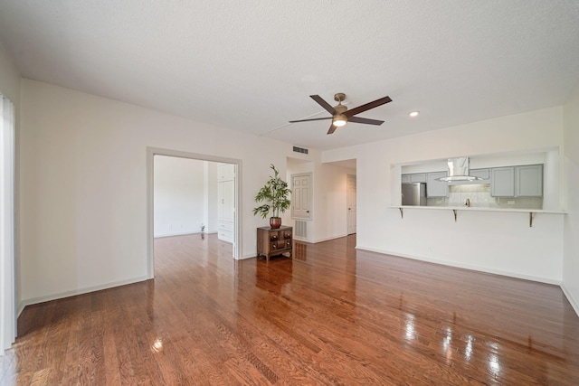 661 Bering Dr Unit 301, Houston, TX 77057 - unfurnished living room featuring a ceiling fan, wood finished floors, baseboards, recessed lighting, and a textured ceiling