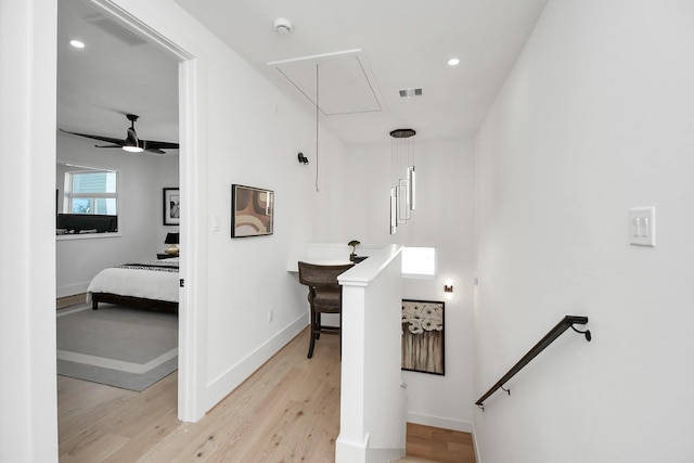 interior space with recessed lighting, wood finished floors, visible vents, baseboards, and attic access