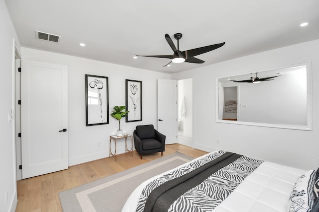 bedroom featuring baseboards, wood finished floors, visible vents, and recessed lighting