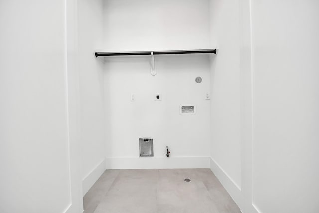 clothes washing area with baseboards, washer hookup, hookup for a gas dryer, electric dryer hookup, and laundry area