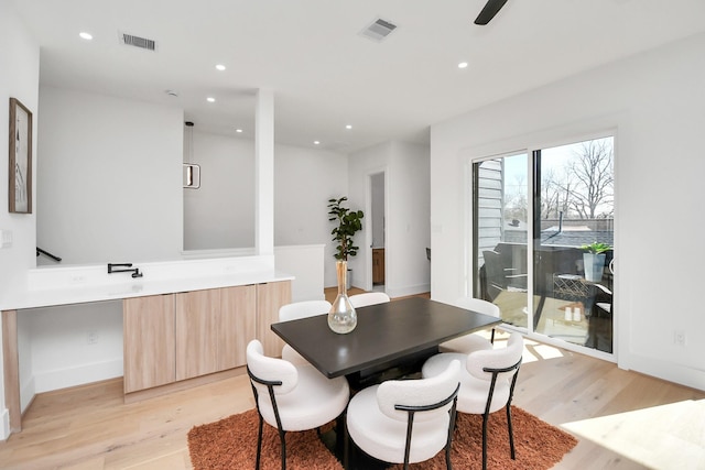 dining space with recessed lighting, light wood-style flooring, and visible vents