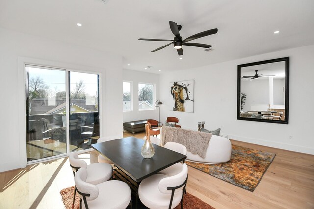 dining space featuring recessed lighting, wood finished floors, a ceiling fan, and baseboards