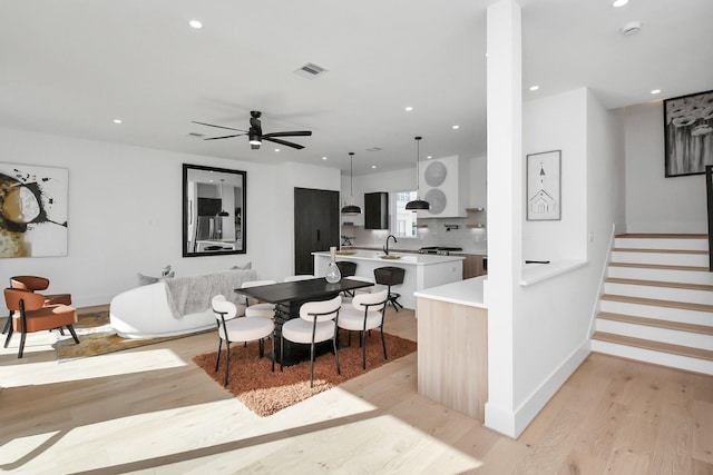 kitchen featuring a ceiling fan, light wood-type flooring, light countertops, visible vents, and recessed lighting