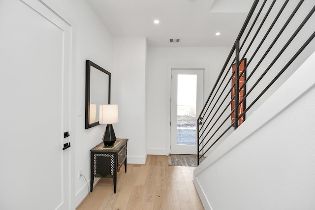 foyer entrance with recessed lighting, stairway, visible vents, light wood-type flooring, and baseboards