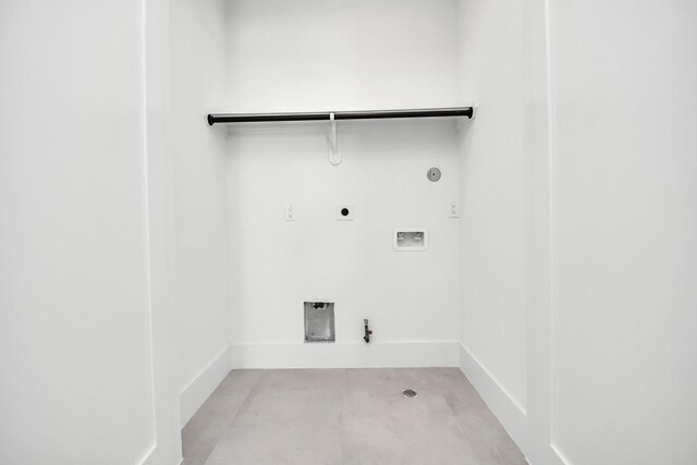 clothes washing area with baseboards, washer hookup, hookup for a gas dryer, electric dryer hookup, and laundry area