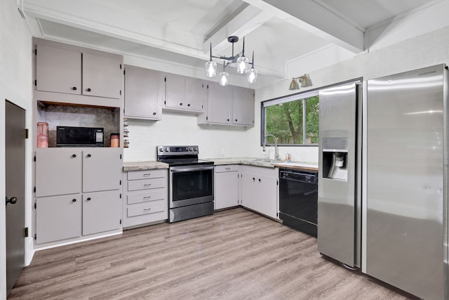 kitchen featuring decorative backsplash, beamed ceiling, light wood-style floors, a sink, and black appliances