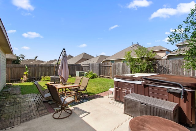 13207 Davenport Hills Ln, Humble, TX 77346 - view of patio / terrace with a fenced backyard, outdoor dining area, a hot tub, and a residential view