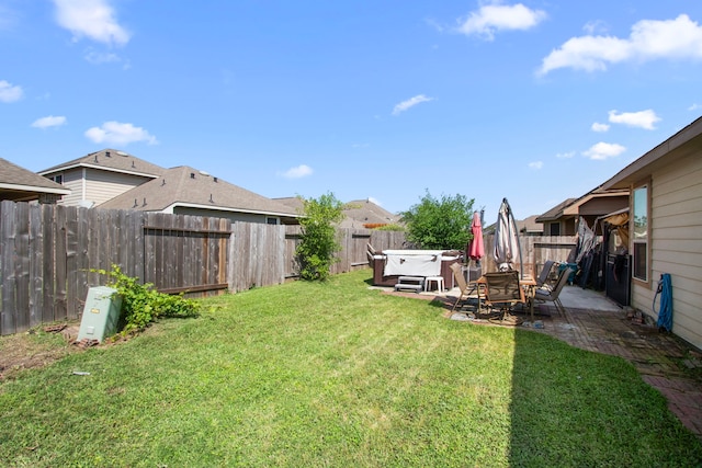 13207 Davenport Hills Ln, Humble, TX 77346 - view of yard with a hot tub, a fenced backyard, and a patio area
