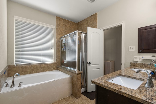 13207 Davenport Hills Ln, Humble, TX 77346 - full bathroom featuring tile patterned floors, a shower stall, a bath, and vanity