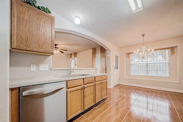 10506 Linsley Ln, Houston, TX 77034 - kitchen featuring light countertops, arched walkways, a sink, pendant lighting, and dishwasher