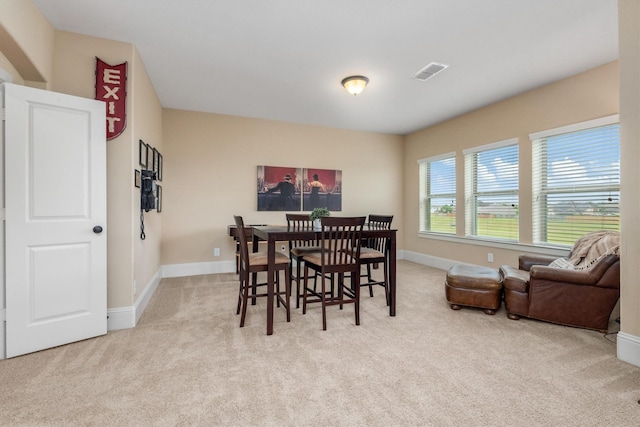 12919 Arlington Meadows Ln, Tomball, TX 77377 - dining space with carpet floors and baseboards