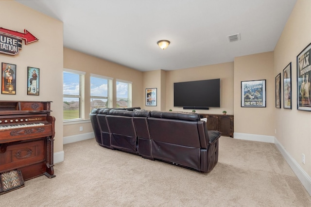 living room featuring carpet floors, visible vents, and baseboards