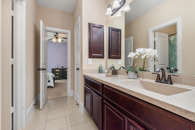 full bath with tile patterned flooring, baseboards, a ceiling fan, and a sink