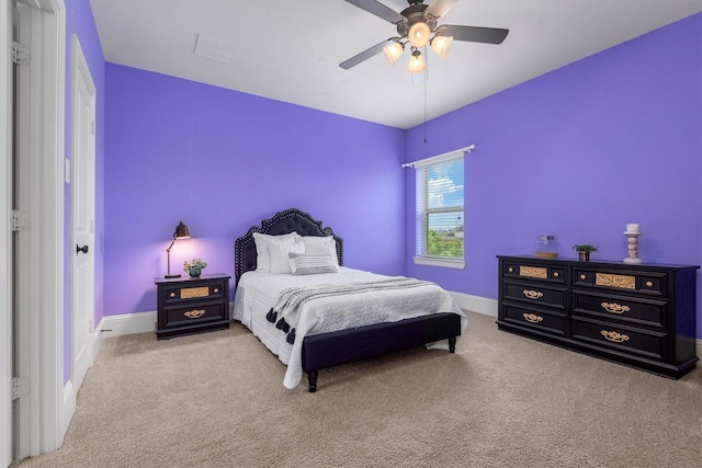 bedroom featuring carpet floors, a ceiling fan, and baseboards