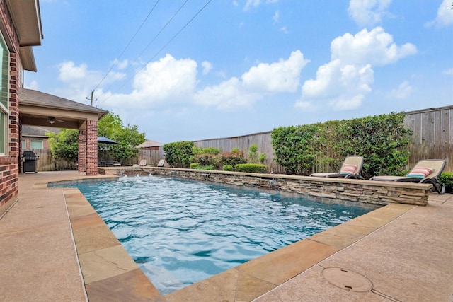 view of swimming pool featuring a fenced backyard, a patio area, a fenced in pool, and grilling area