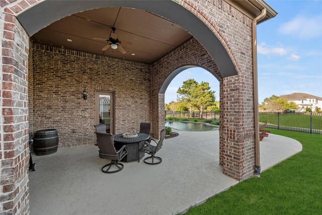 view of patio / terrace featuring a fenced in pool, ceiling fan, and fence