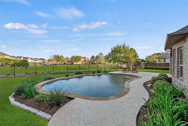 view of pool with a yard, a fenced in pool, a patio, and a fenced backyard