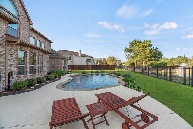 view of swimming pool with a lawn, a fenced backyard, a fenced in pool, and a patio
