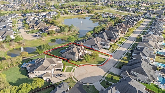 aerial view with a residential view and a water view