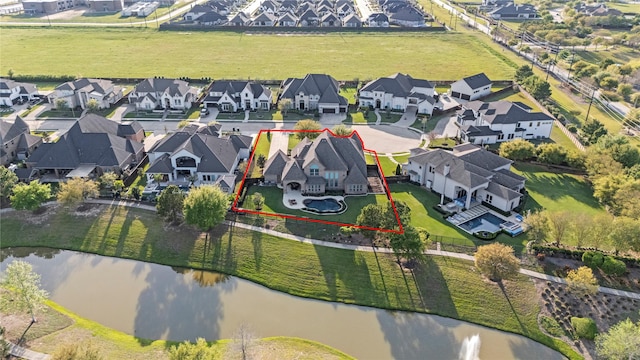 aerial view with a residential view and a water view
