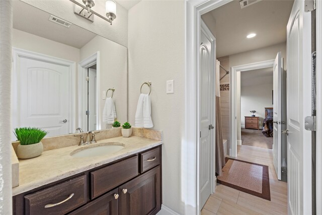 full bath featuring recessed lighting, walk in shower, visible vents, and vanity