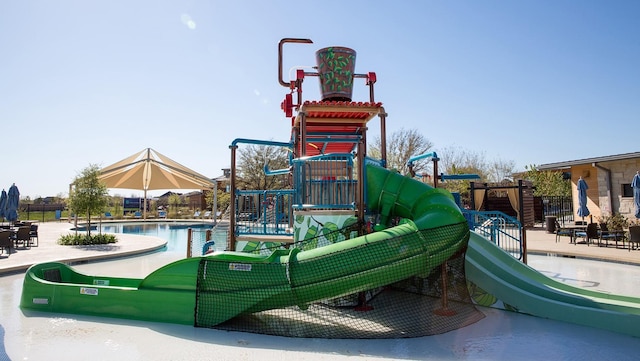 communal playground featuring a water play area and a community pool
